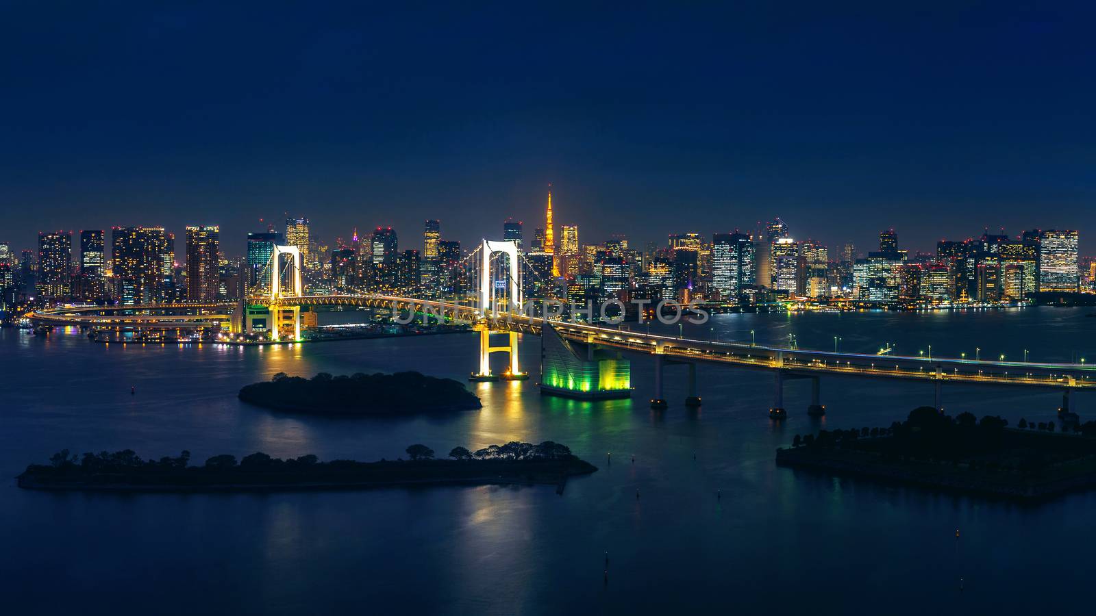 Panorama of tokyo cityscape and rainbow bridge at night. by gutarphotoghaphy
