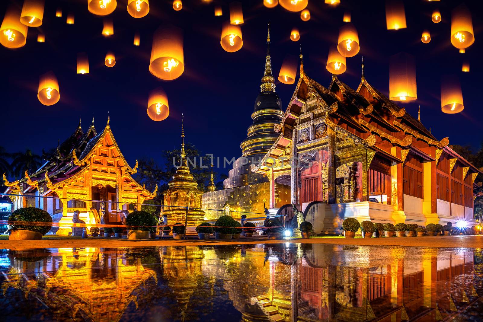 Yee peng festival and sky lanterns at Wat Phra Singh temple at night in Chiang mai, Thailand. by gutarphotoghaphy