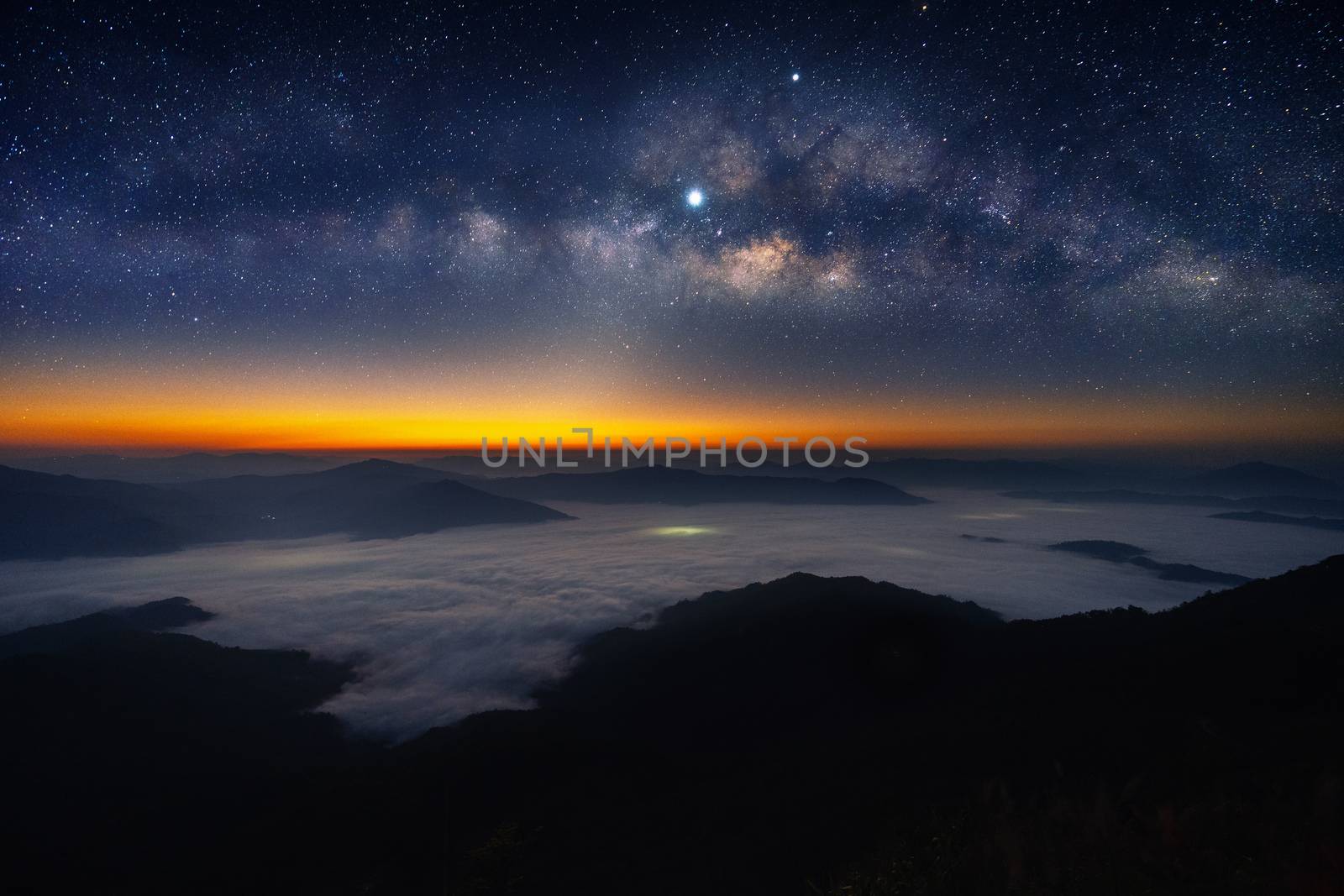 Milky way galaxy and star over mountains. by gutarphotoghaphy