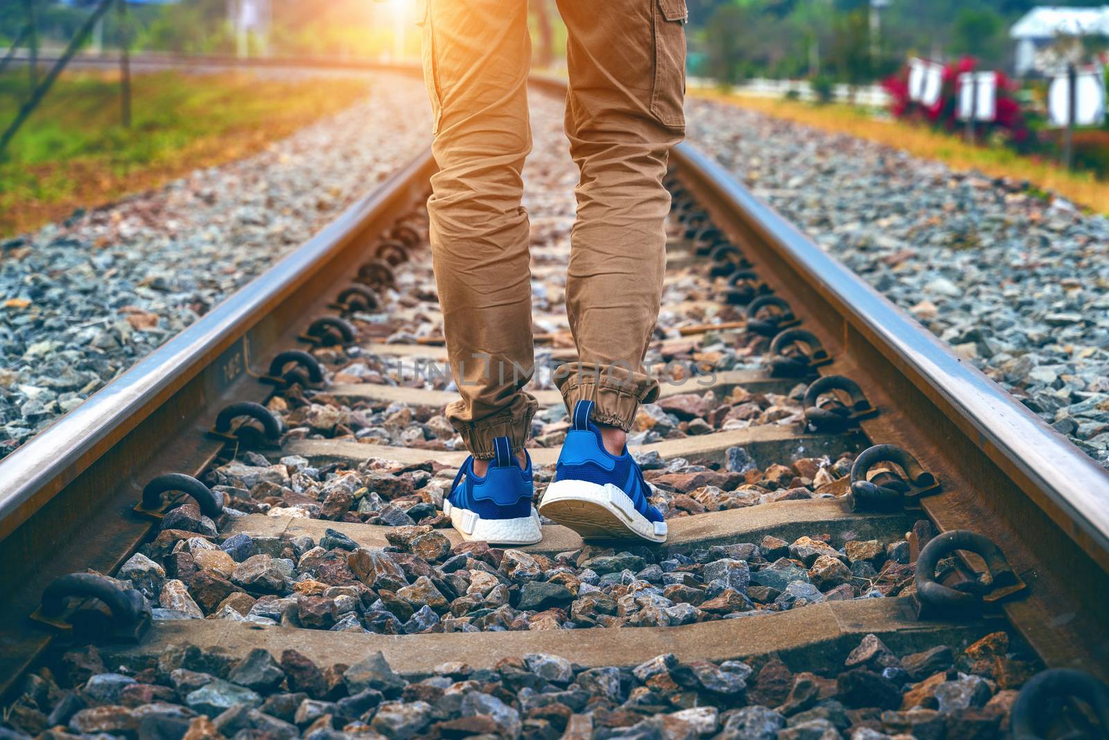 Feet of male walking on railroad. Travel concept. by gutarphotoghaphy