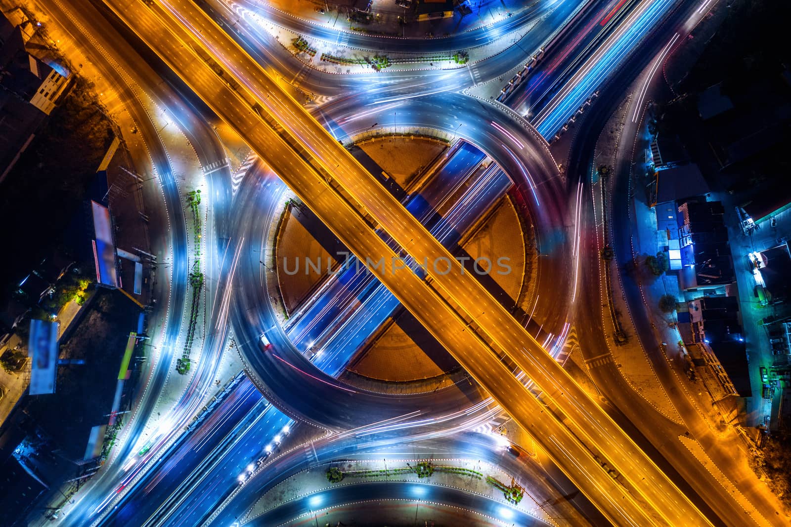 Aerial view of traffic in roundabout and highway at night. by gutarphotoghaphy