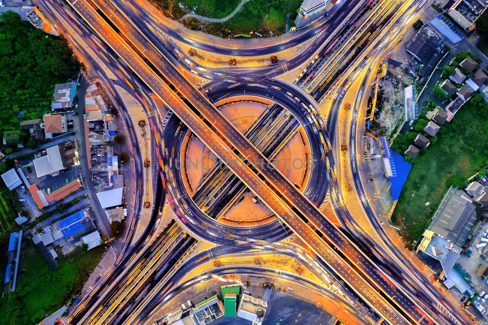 Aerial view of traffic in roundabout and highway at night. by gutarphotoghaphy