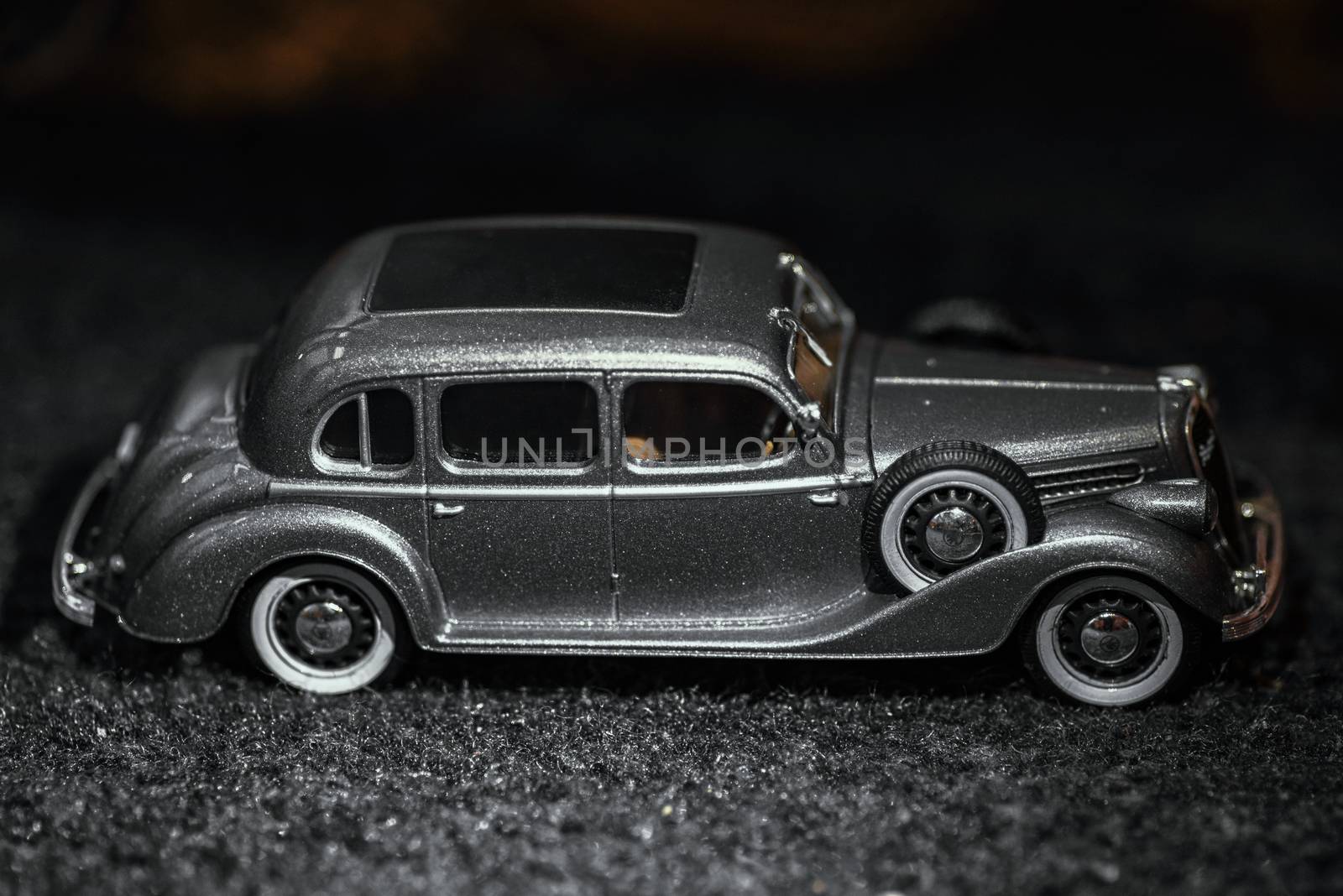 Car close-up.Dark grey vintage car . Retro car's close up.Retro car on a dark background. Car close-up.