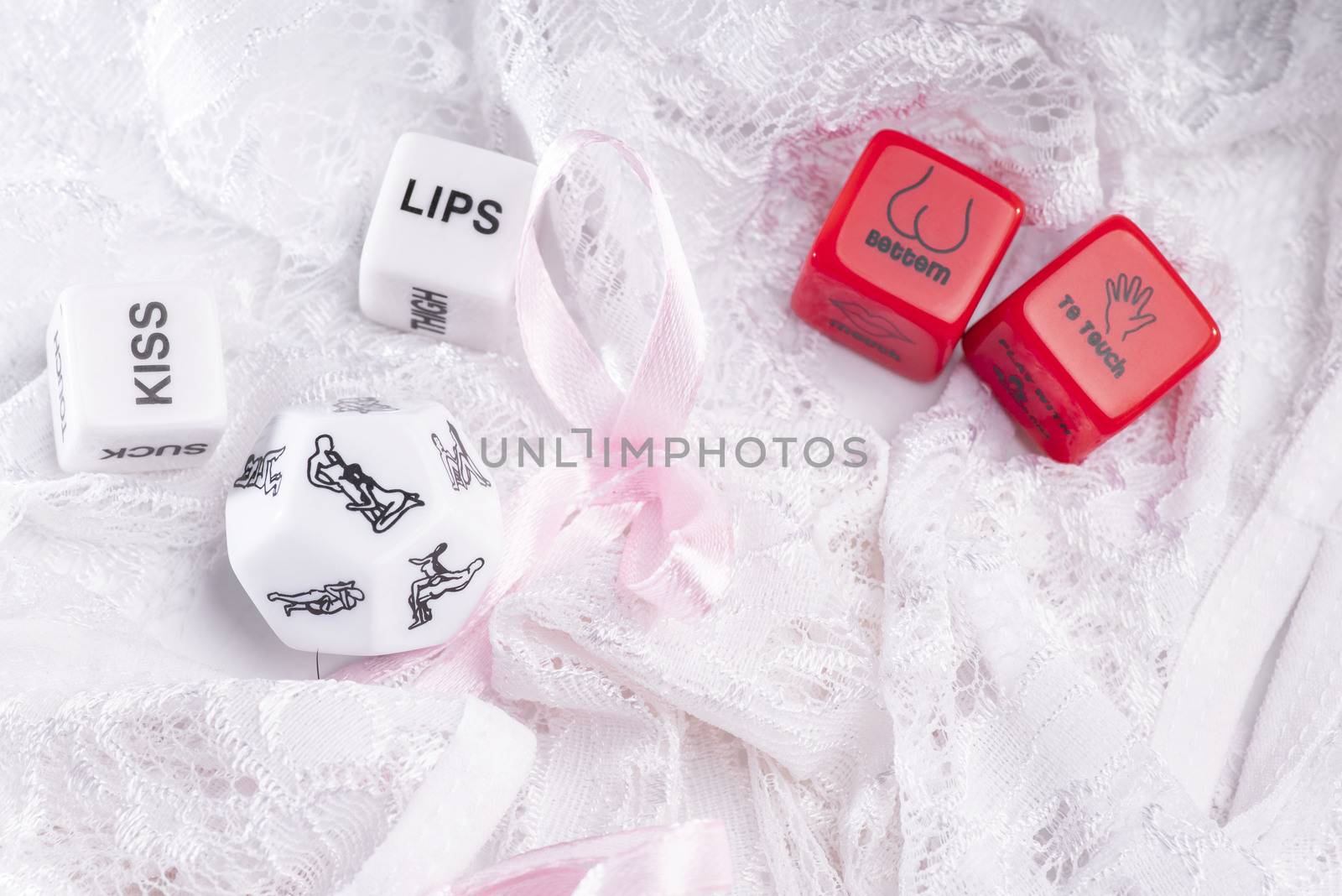 Cube with sexy poses, Kama Sutra. Toys for adults. Sex toys. Cubes with Kama Sutra poses for sex games. Playing cubes of red and white color for sexual games.