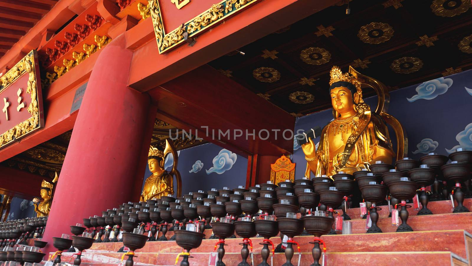 Burning big red candles in Buddhist temple in China