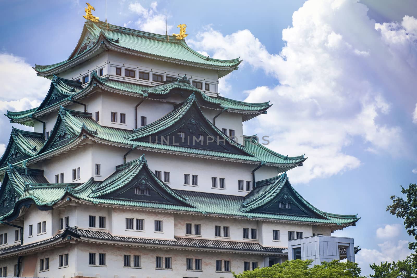 Famous Japanese castle with a green roof.Japan Castle in Nagoya. Summer day.