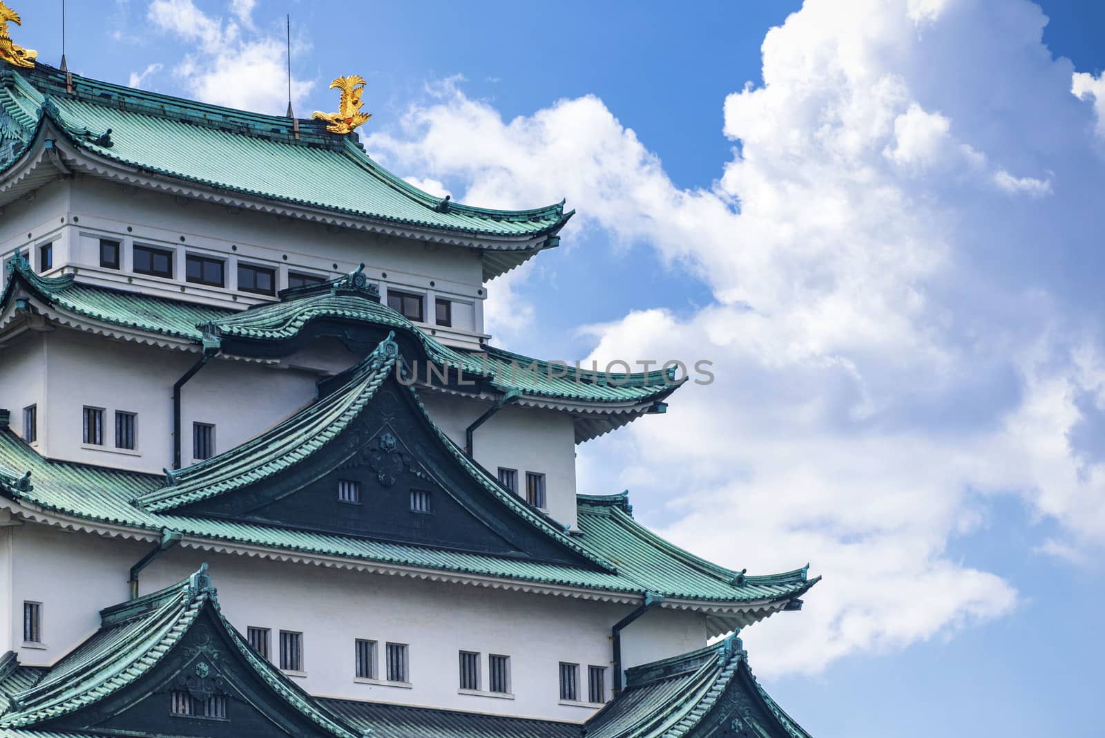 Famous Japanese castle with a green roof.Japan Castle in Nagoya. Summer day.