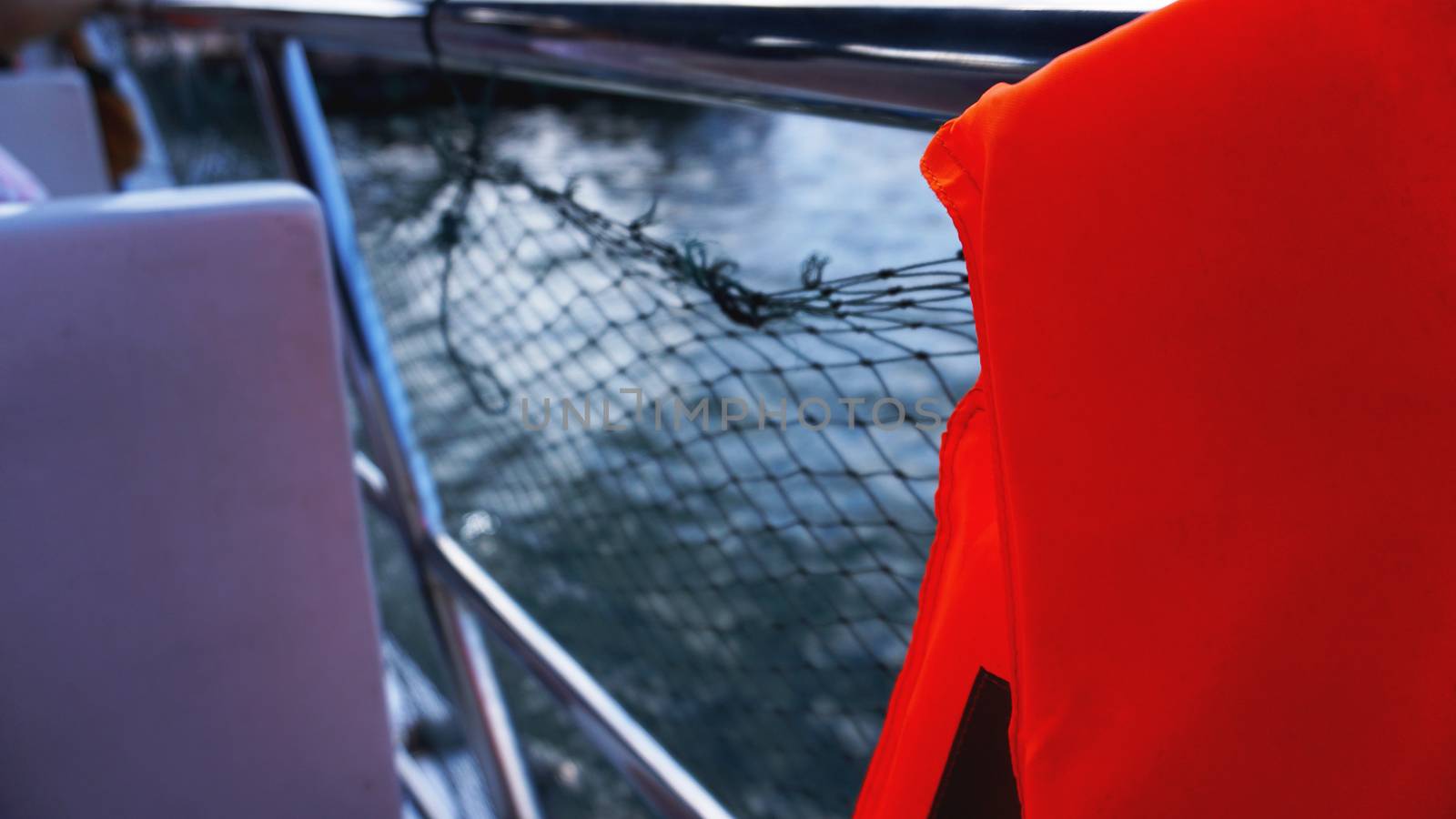 Life jacket and net on boat by natali_brill