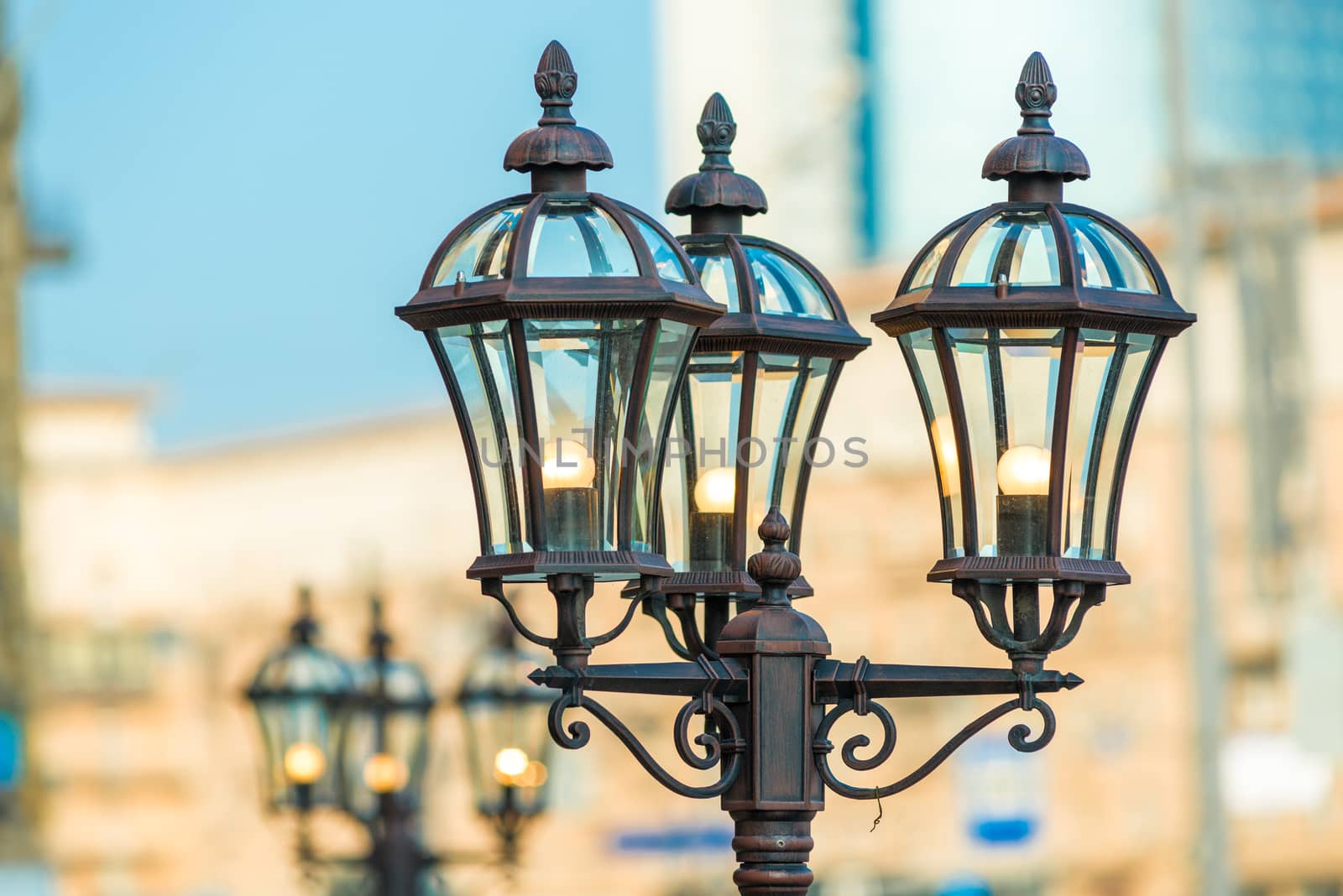 Closeup of vintage metal lantern in the city by kosmsos111