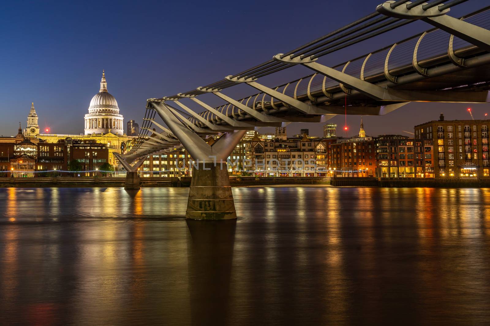 St paul cathedral with millennium bridge sunset twilight in London UK. 