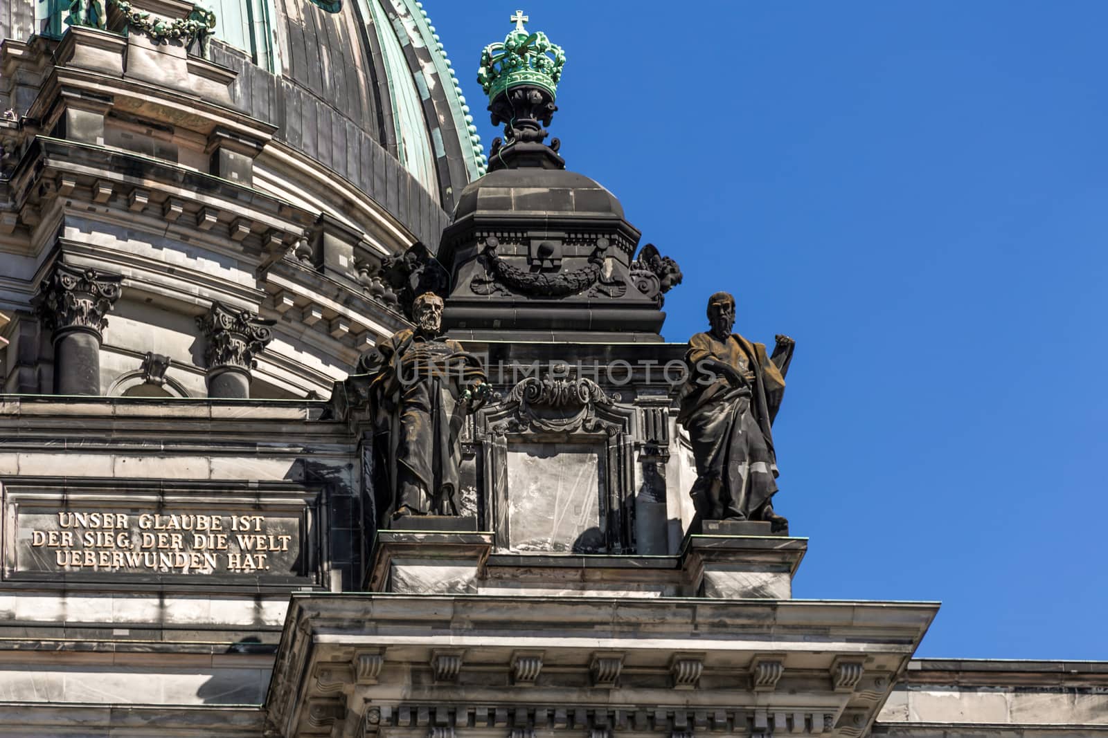 A close-up exterior view on a sculptural composition on the roof of Dom Berliner, also known as the Berlin Cathedral in the historic city of Berlin in Germany.