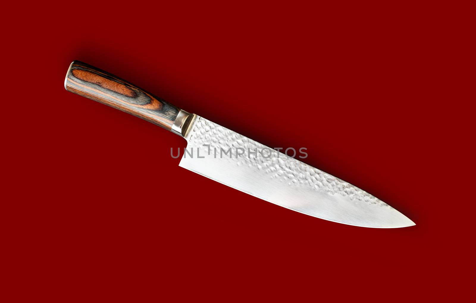 Chef's knife for your kitchen isolated on red by SlayCer