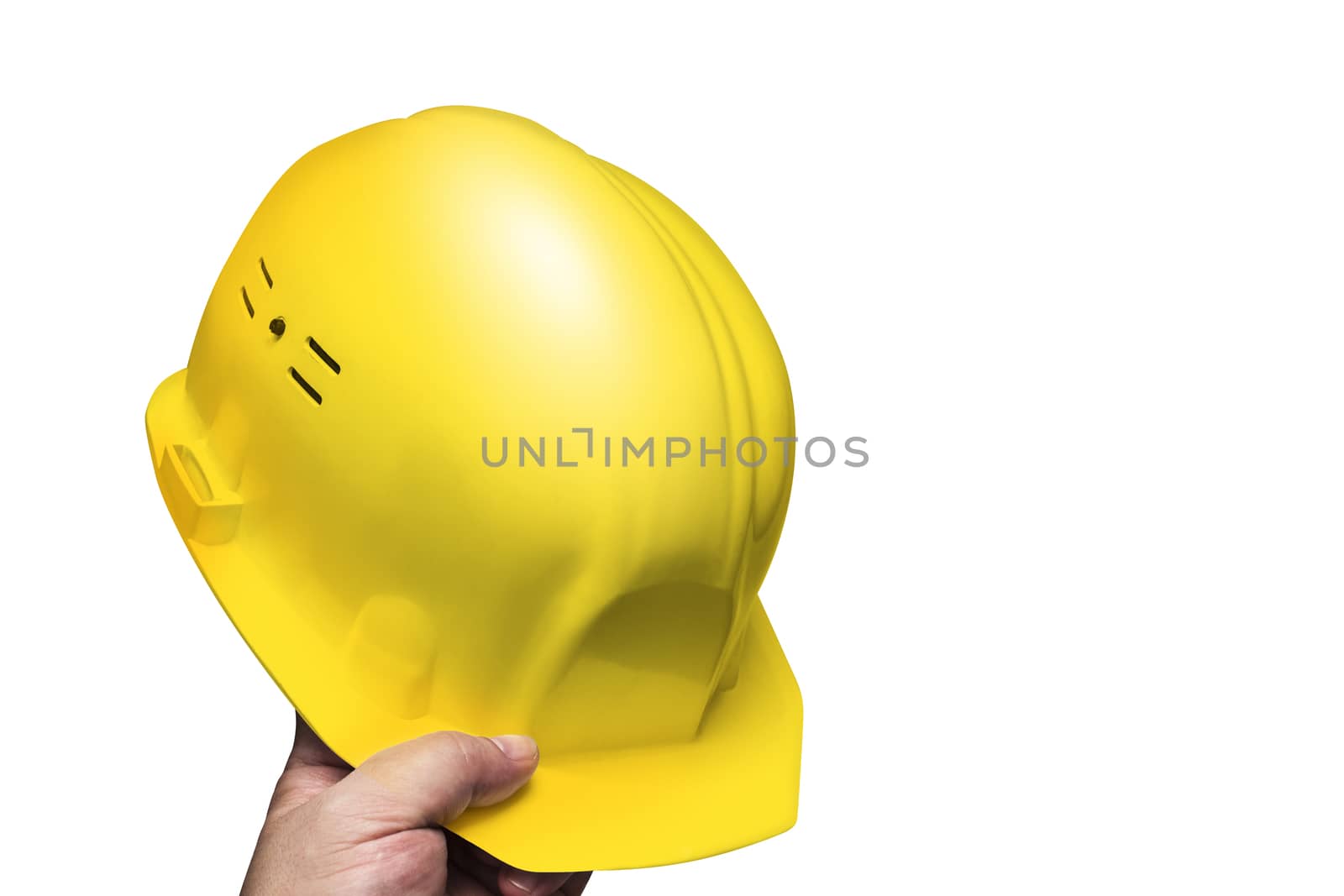 Construction yellow color helmet, head protection in hand men. Isolated on white background