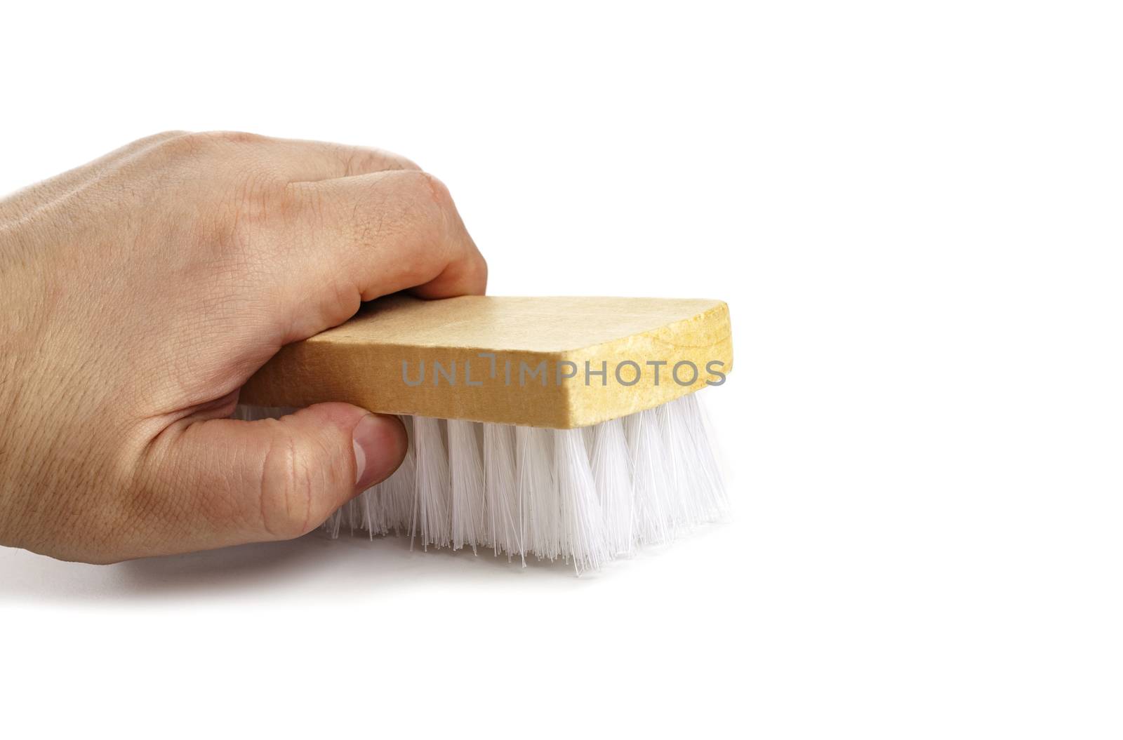 Brush for clothes in a man's hand close-up isolated on white by SlayCer