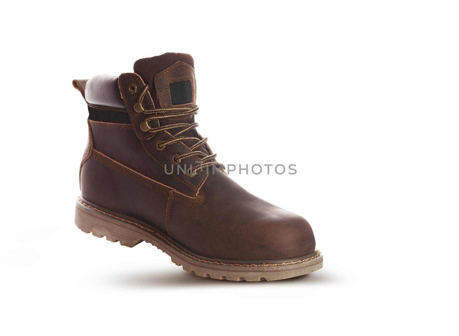 Man ankle boots, brown color, with nubuck leather. Isolated on white background, closed up