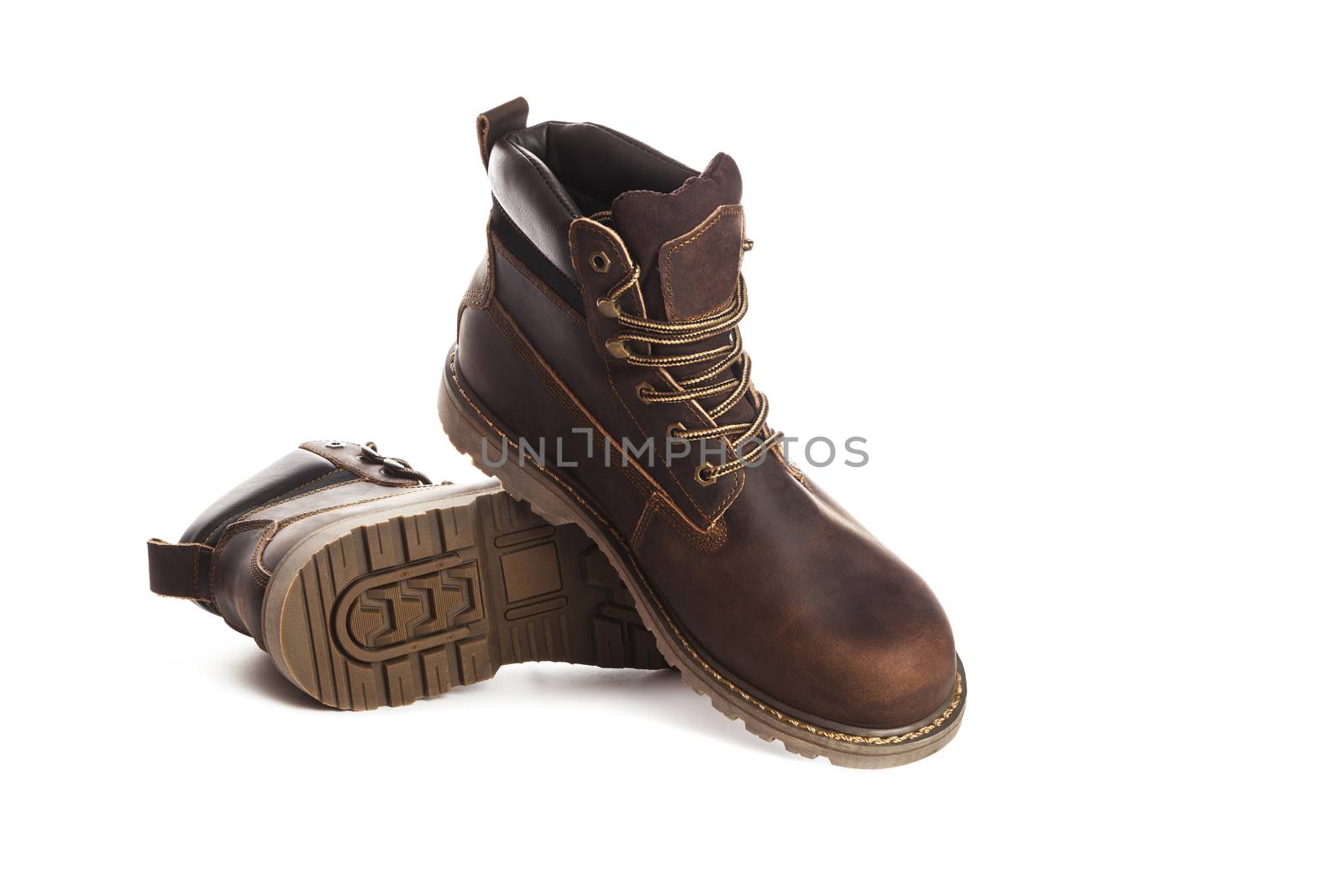 Man ankle boots, brown color, with nubuck leather. Isolated on white background, closed up