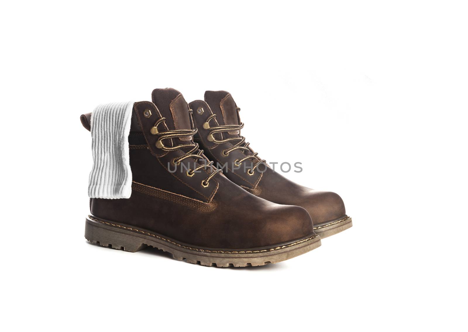 Man ankle boots, brown color, with nubuck leather, with white socks inside. Isolated on white background, closed up