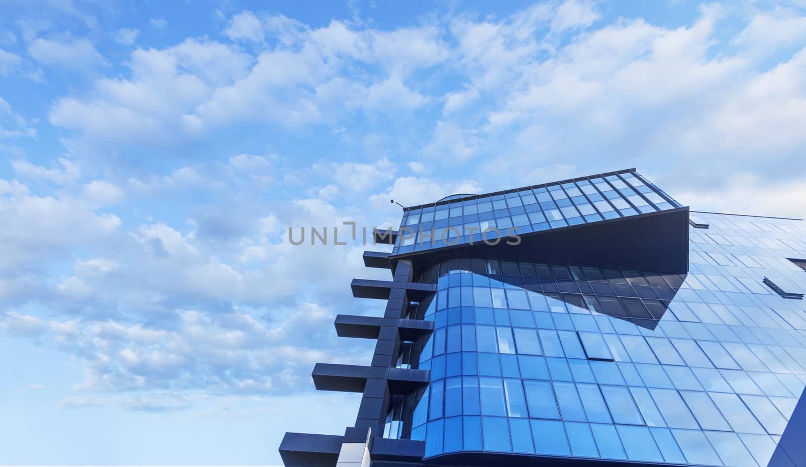 Beautiful skyscraper with architecture and glass window exterior of building around business area in the city. Closeup