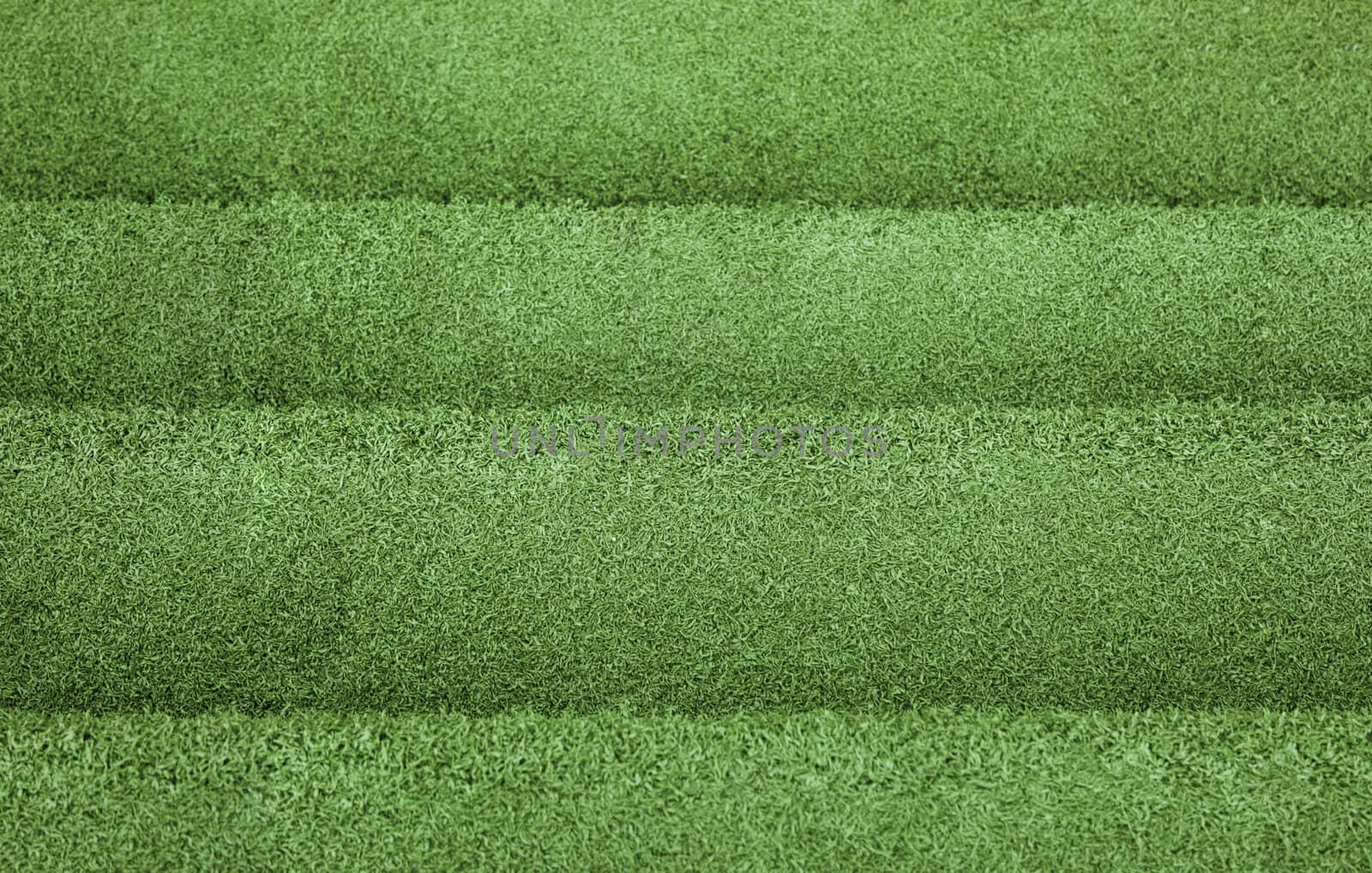 Green artificial grass texture background