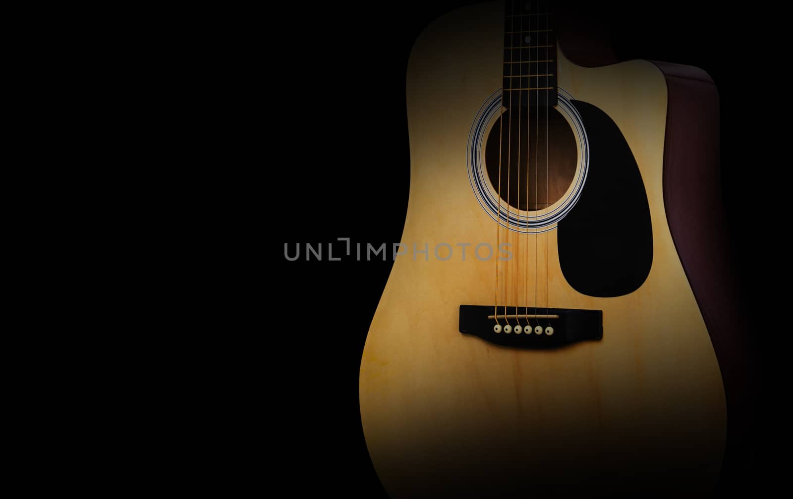 Part of acoustic guitar on old black background, concept