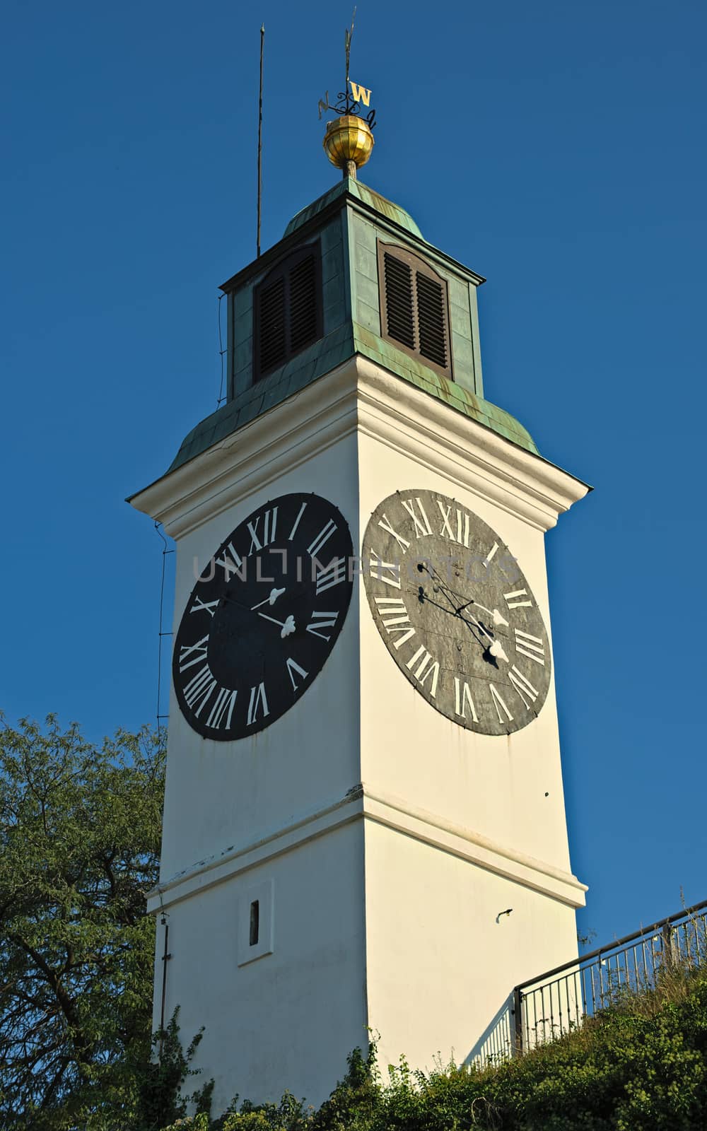 Clock tower with small bell tower at top in Novi Sad, Serbia by sheriffkule