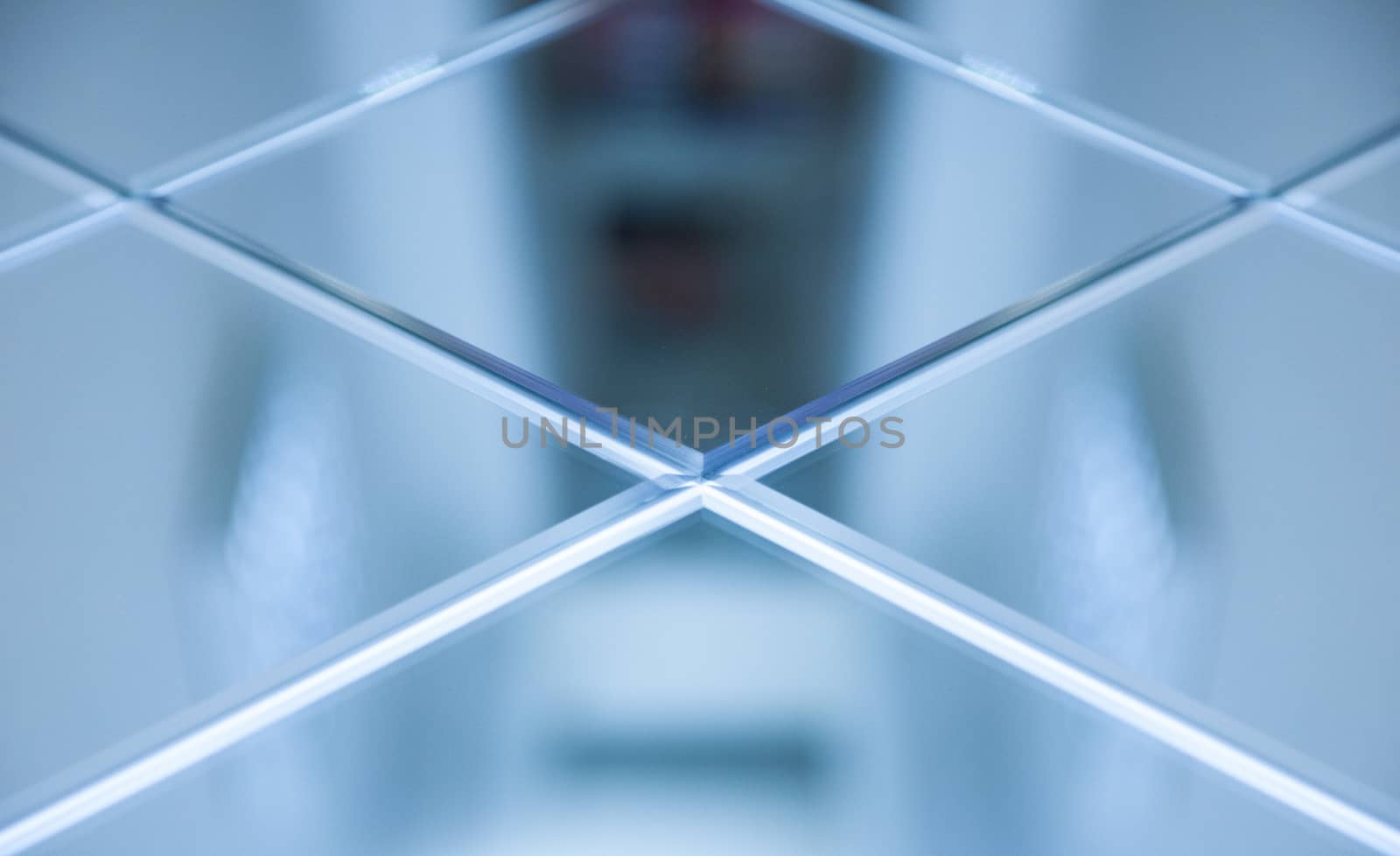 Glass, mirror reflection shapes and shadows. Close-up details.  Abstract geometric design with parallel and intersecting lines. Graphical representation of angle