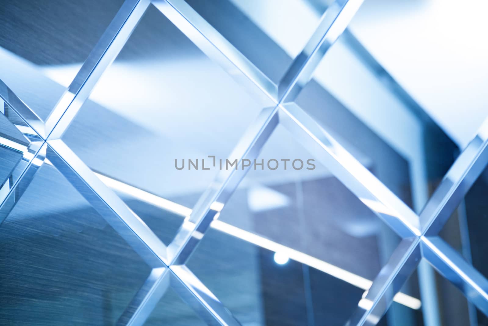 Glass, mirror reflection shapes and shadows. Close-up details.  Abstract geometric design with parallel and intersecting lines. Graphical representation of angle