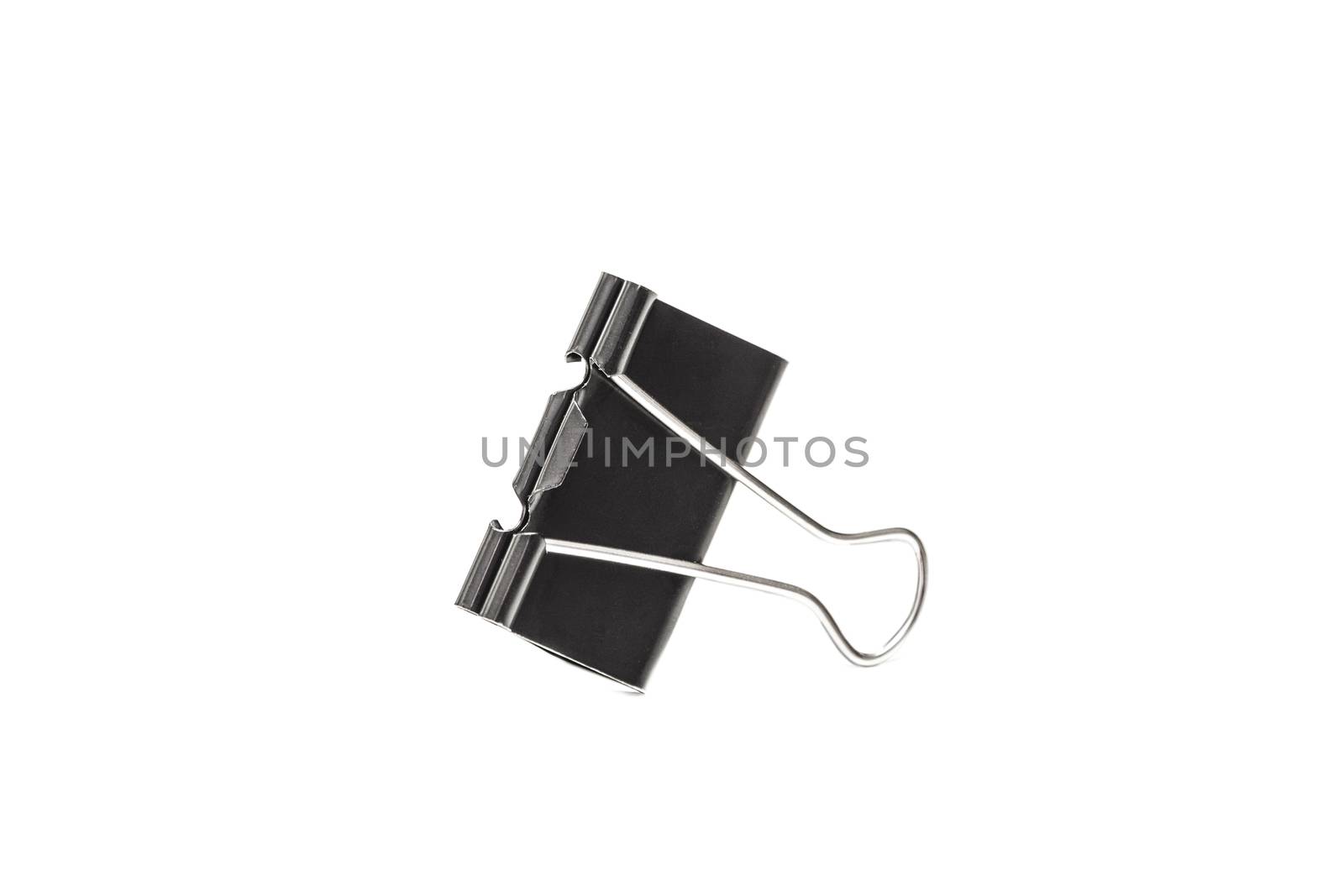 Paper clip isolated from white background. A paperclip is a device for office use to clamp a device such as paper and more.