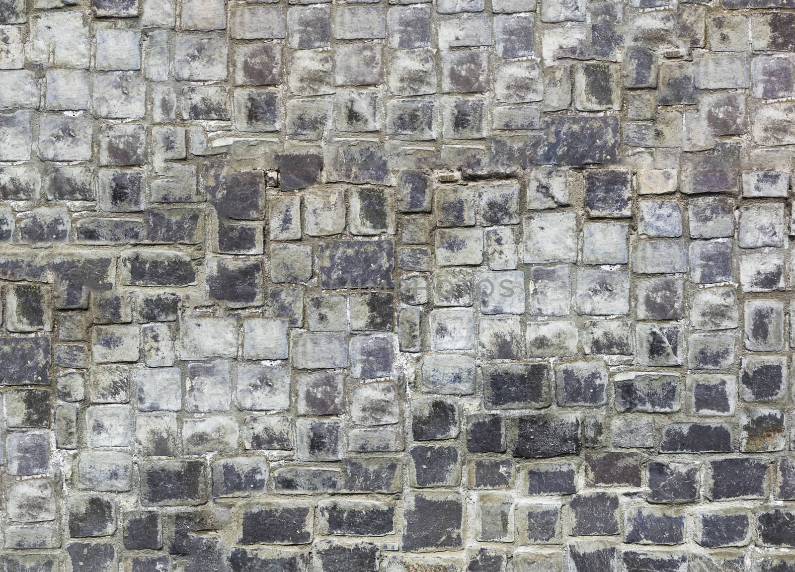 Antique natural stonewall, old stones in different sizes