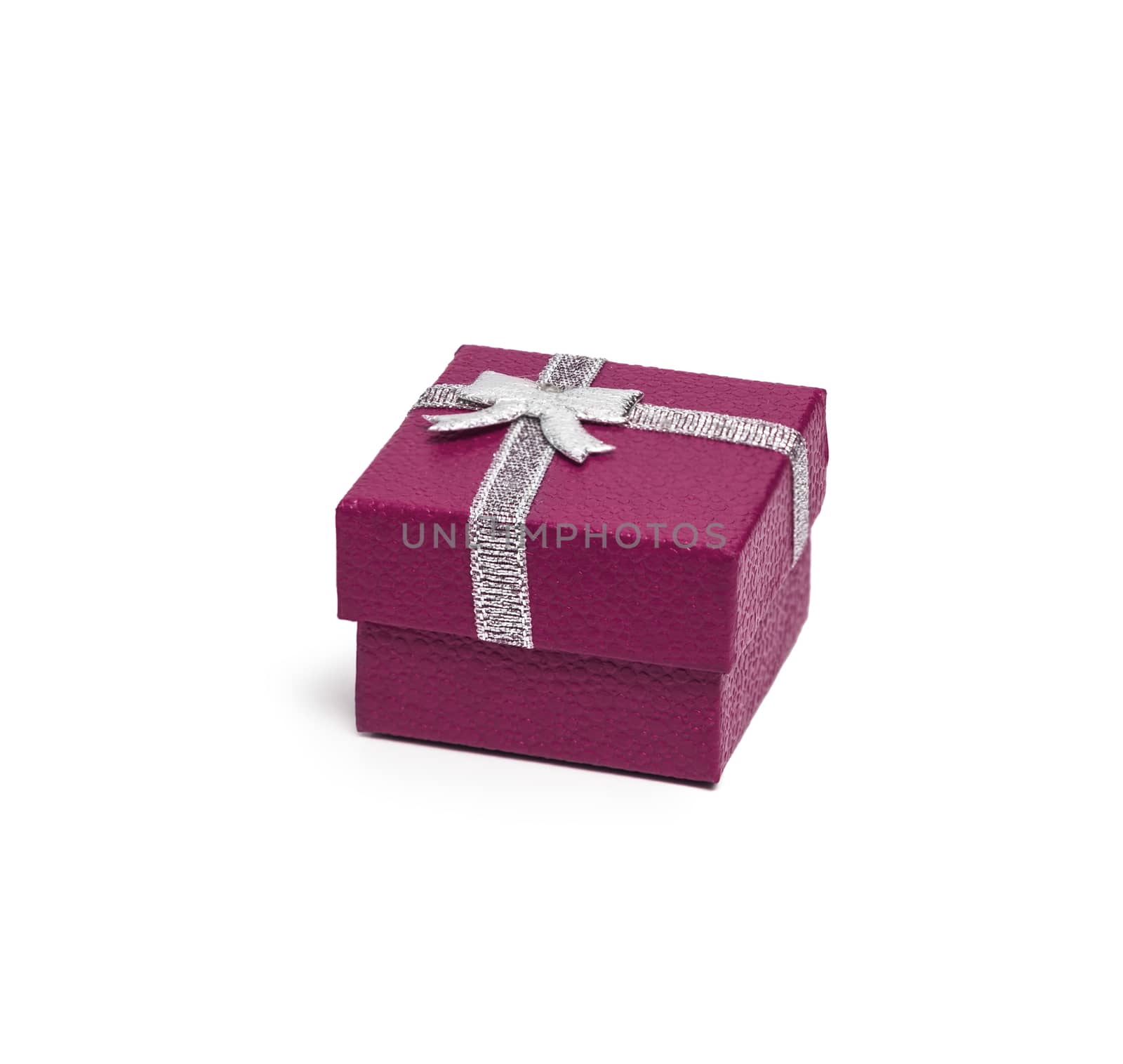 Purple gift box with silver ribbon isolated on white background