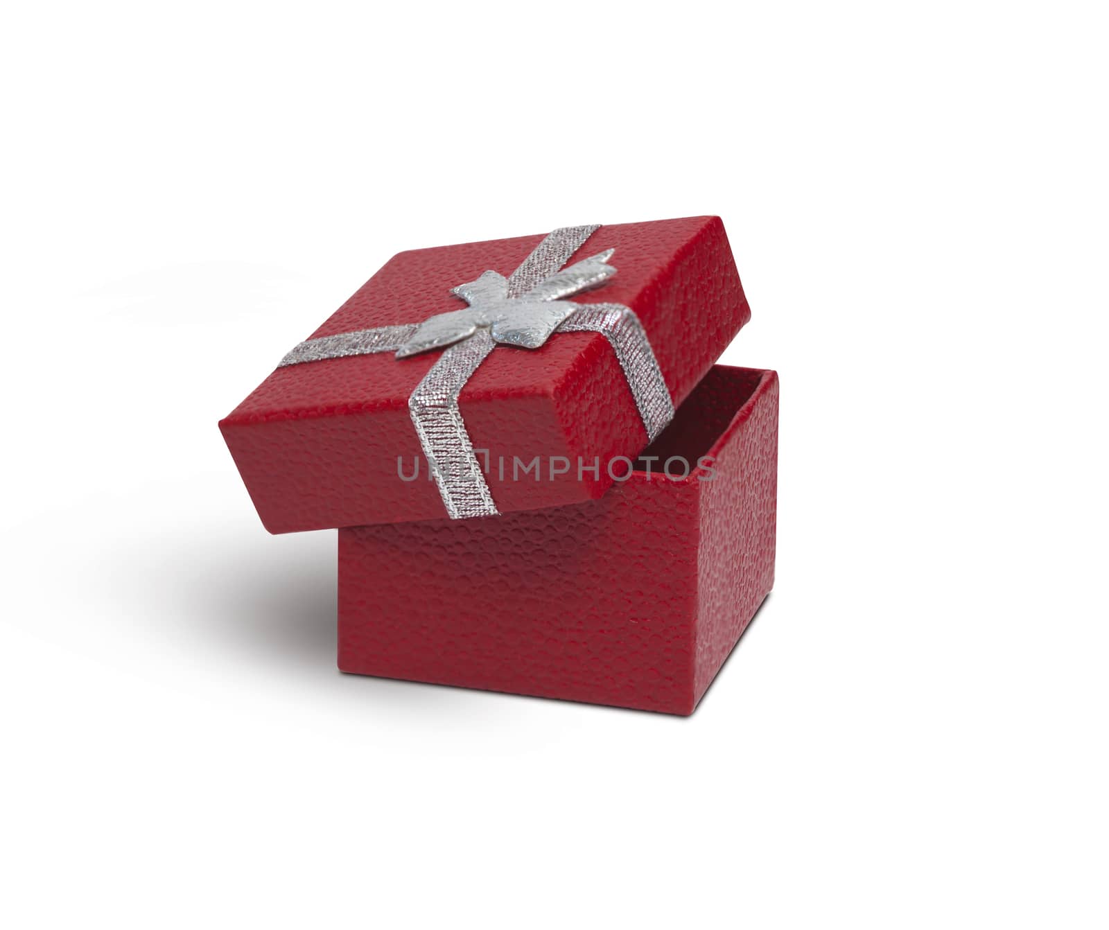 Open Red gift box with silver ribbon isolated on white background