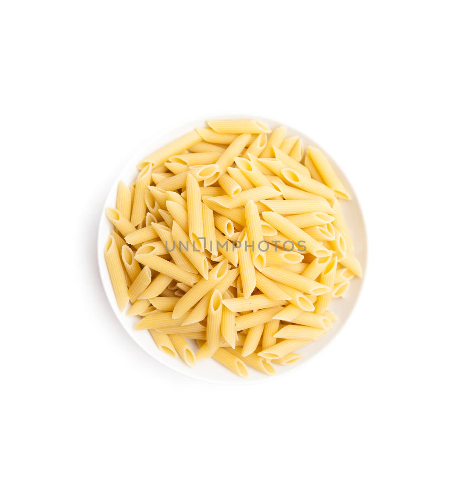 Pasta penne macaroni in bowl over isolated on a white background. Products from flour.