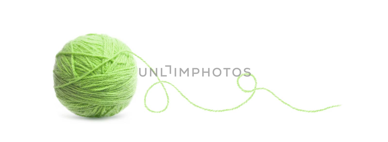 Green ball of Threads wool yarn isolated on white background