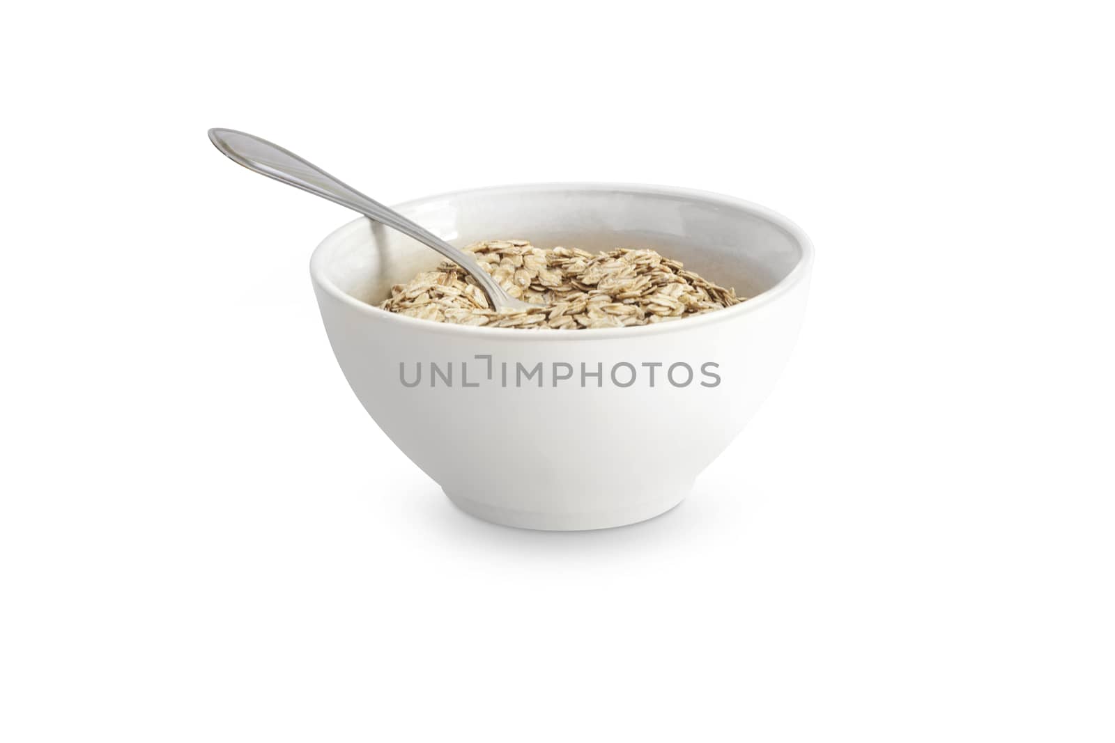 Food. Oatmeal or dry cereal in a white bowl. Isolated on white background. With clipping path