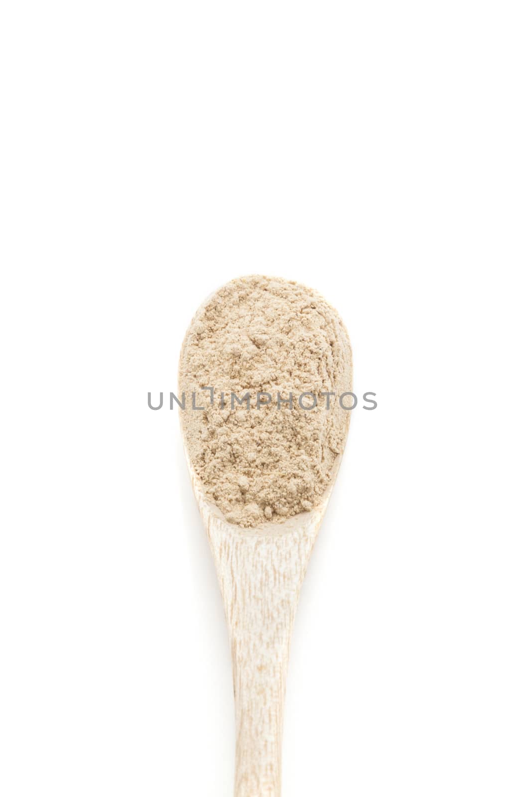 Dry garlic spices in wooden spoon isolated on white background