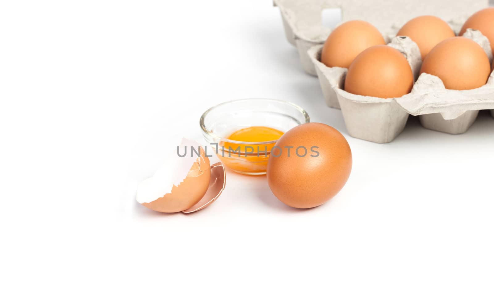 Chicken eggs in pulp egg carton isolated on white background