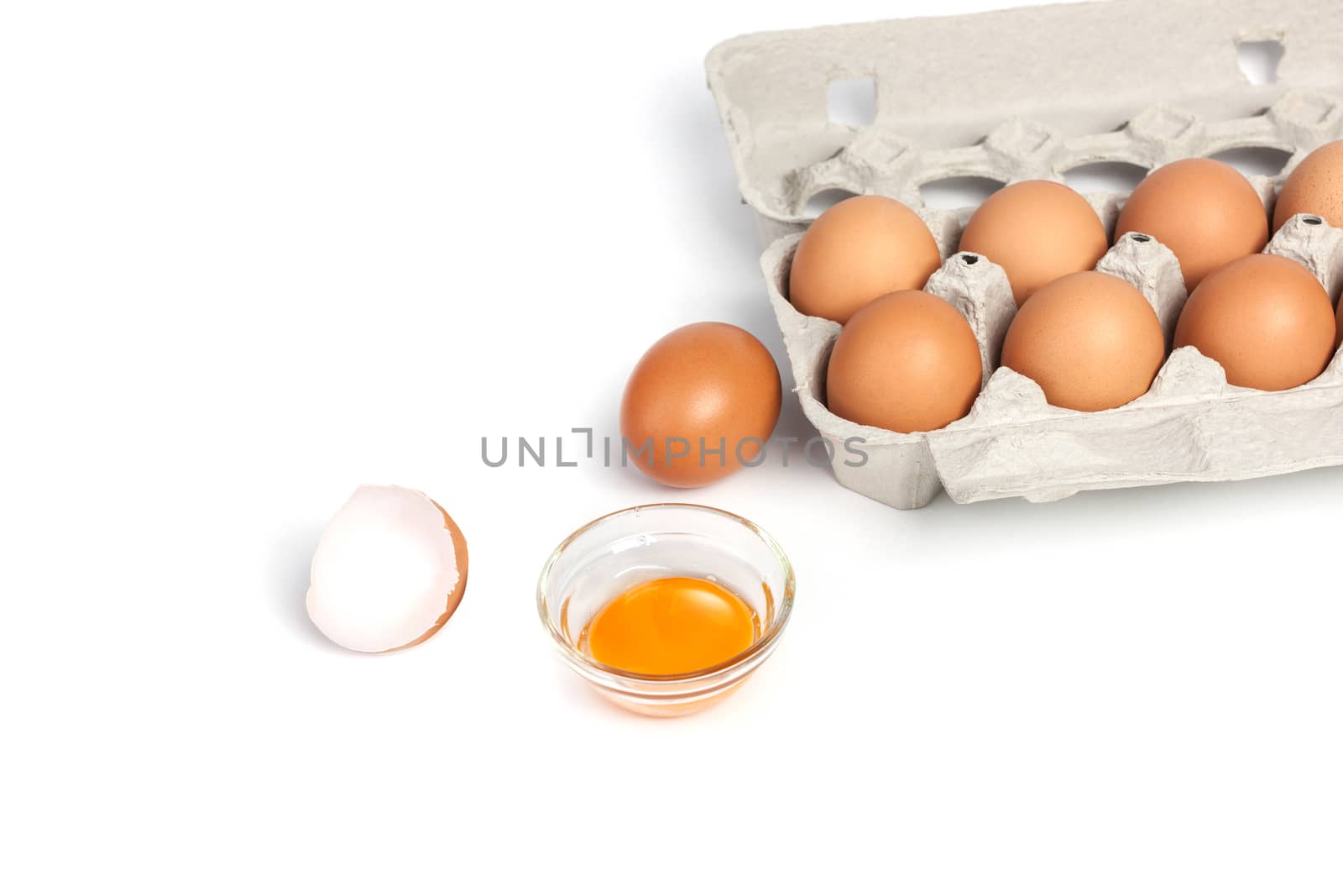 Chicken eggs in pulp egg carton isolated on white background