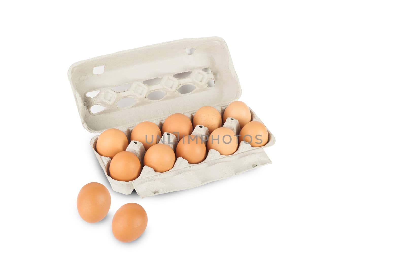 Chicken eggs in pulp egg carton isolated on white background