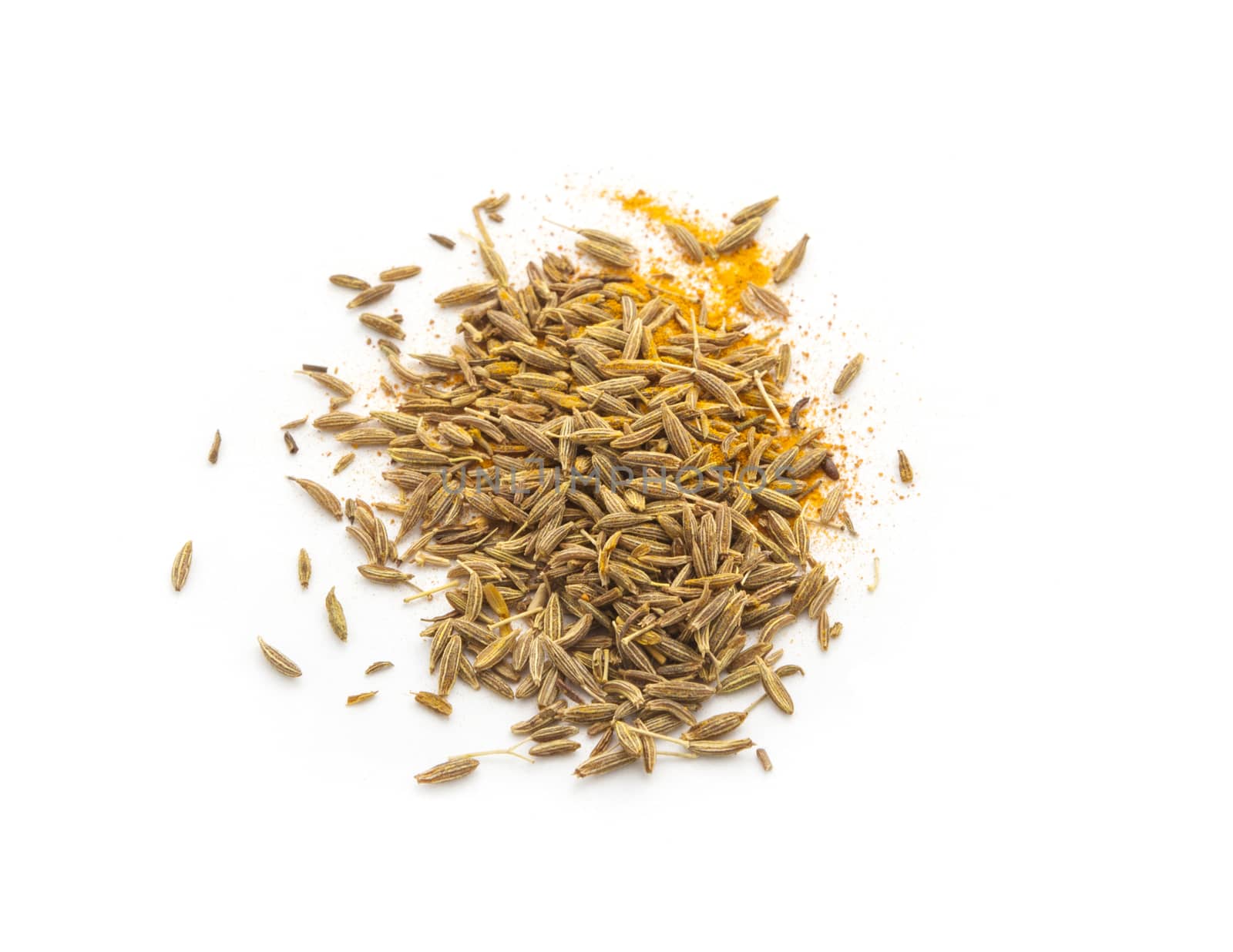 Pile of cumin seeds isolated on white background