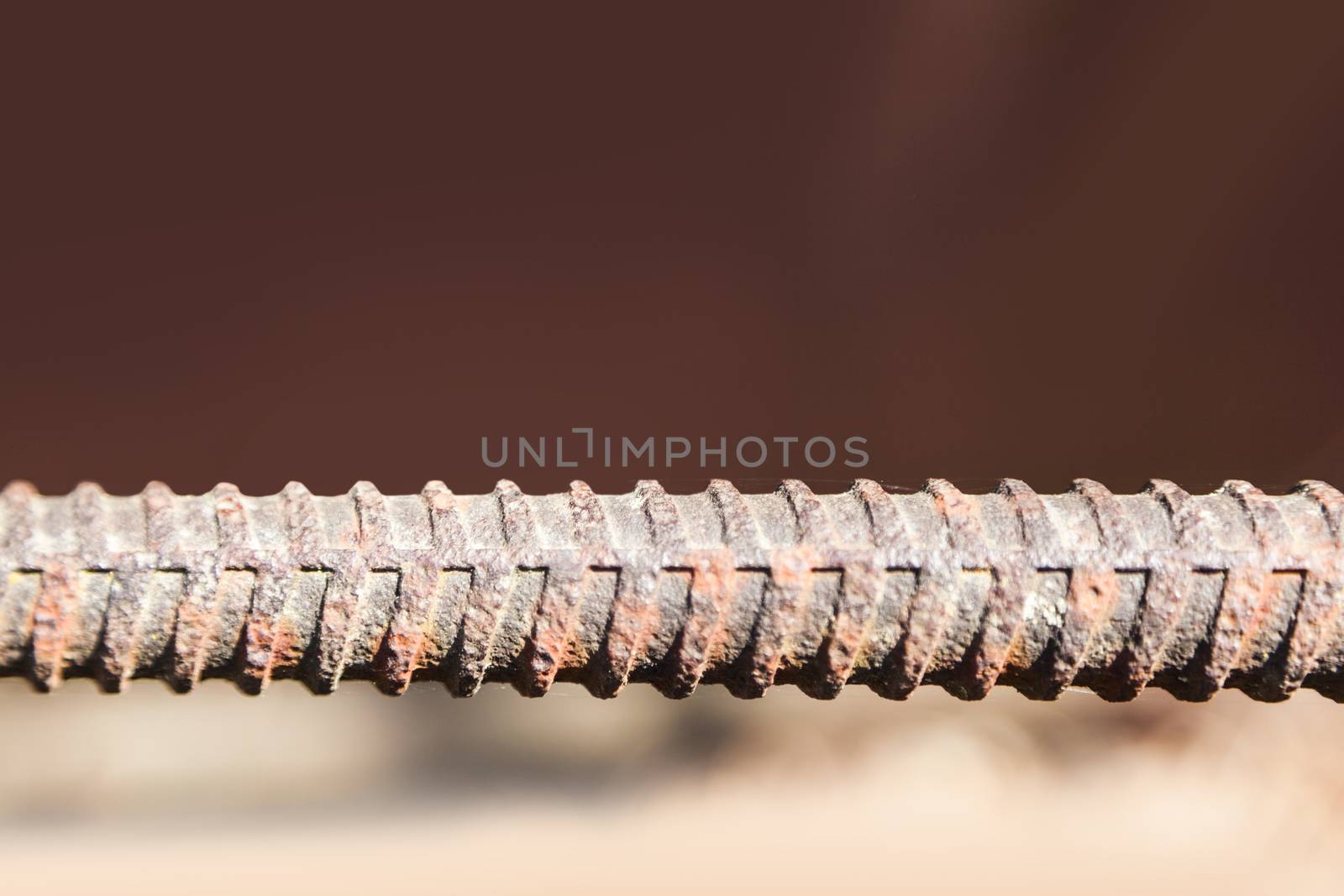 Reinforce steel iron rod. Metal fittings, rebar texture. Closeup macro steel used in construction concrete.