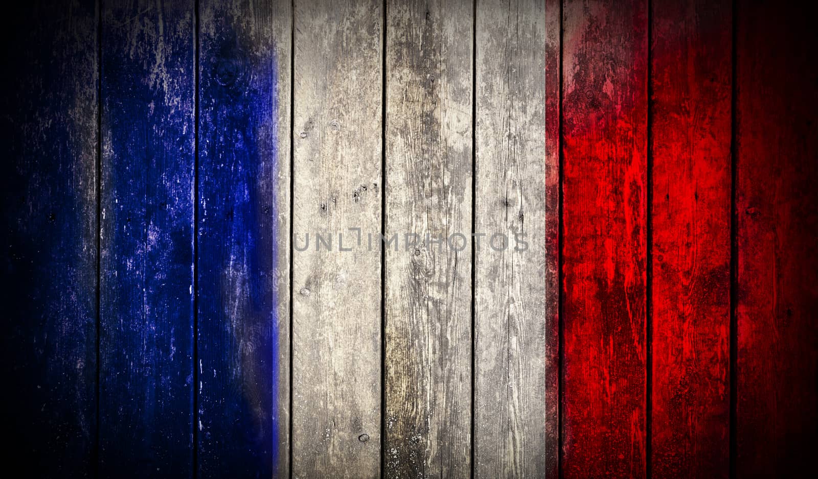 Flag of France painted on grungy wooden plank background