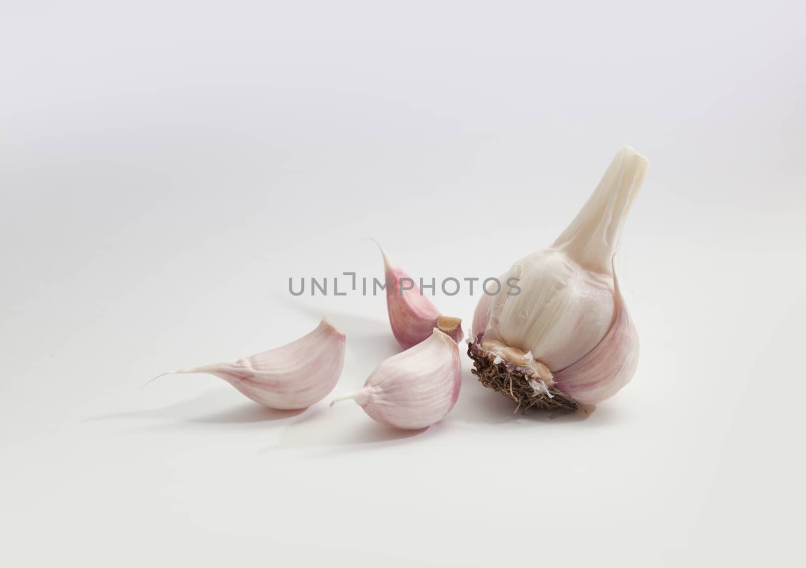 Garlic group and slices. Isolated on white background.