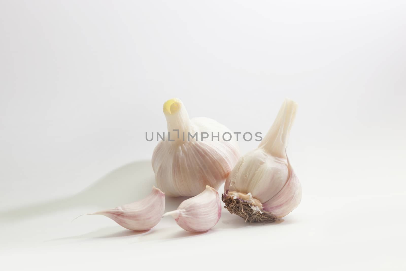 Garlic group and slices. Isolated on white background.