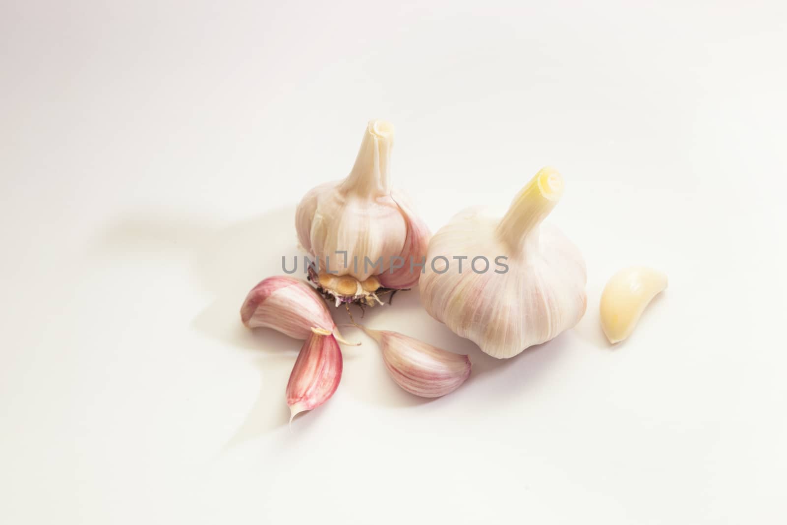 Garlic group and slices. Isolated on white background.