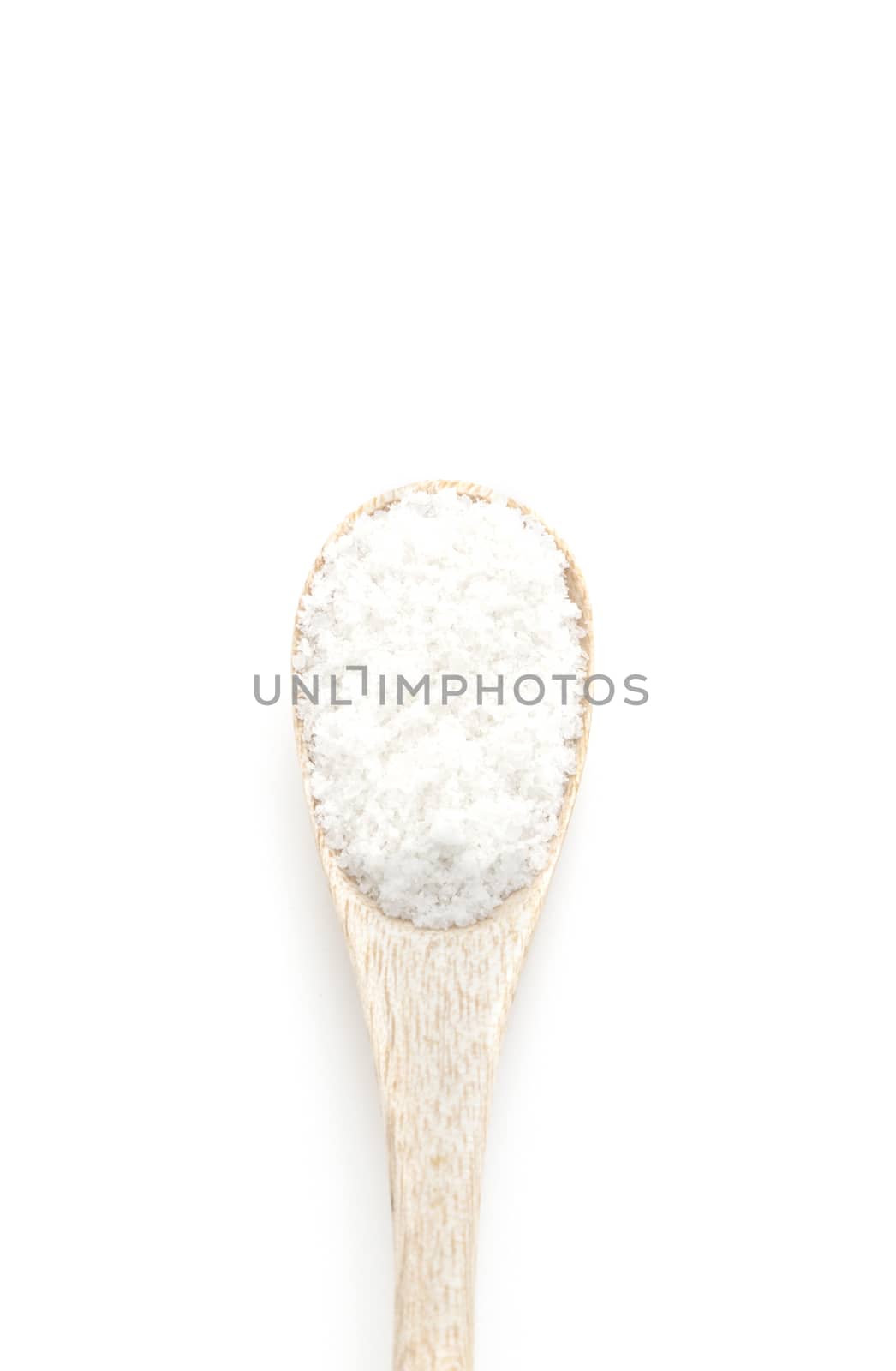 Salt spice in wooden spoon isolated on white background