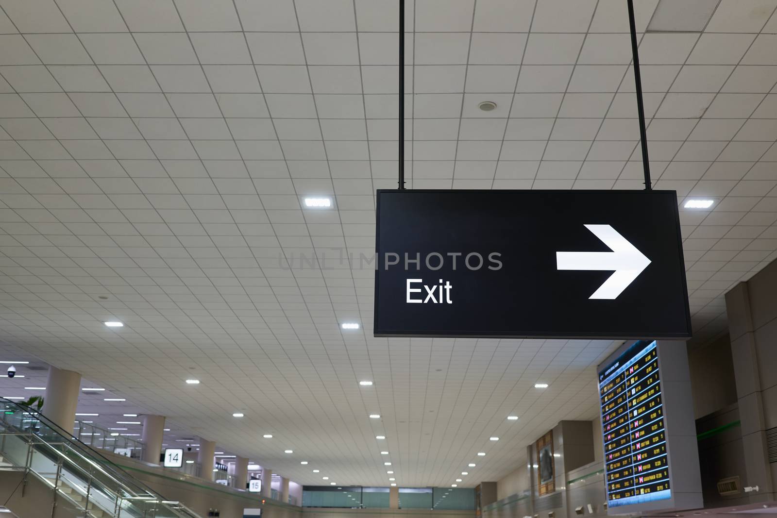 Exit and arrow information board sign international airport terminal by eaglesky