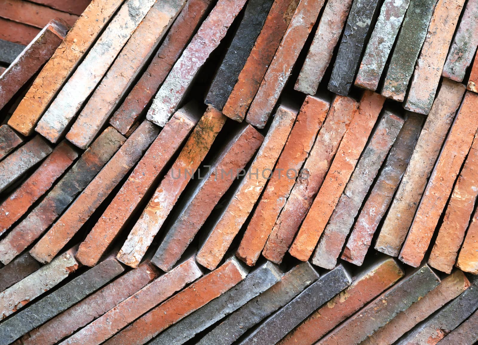 Background of old clay tiles in a pile by Goodday