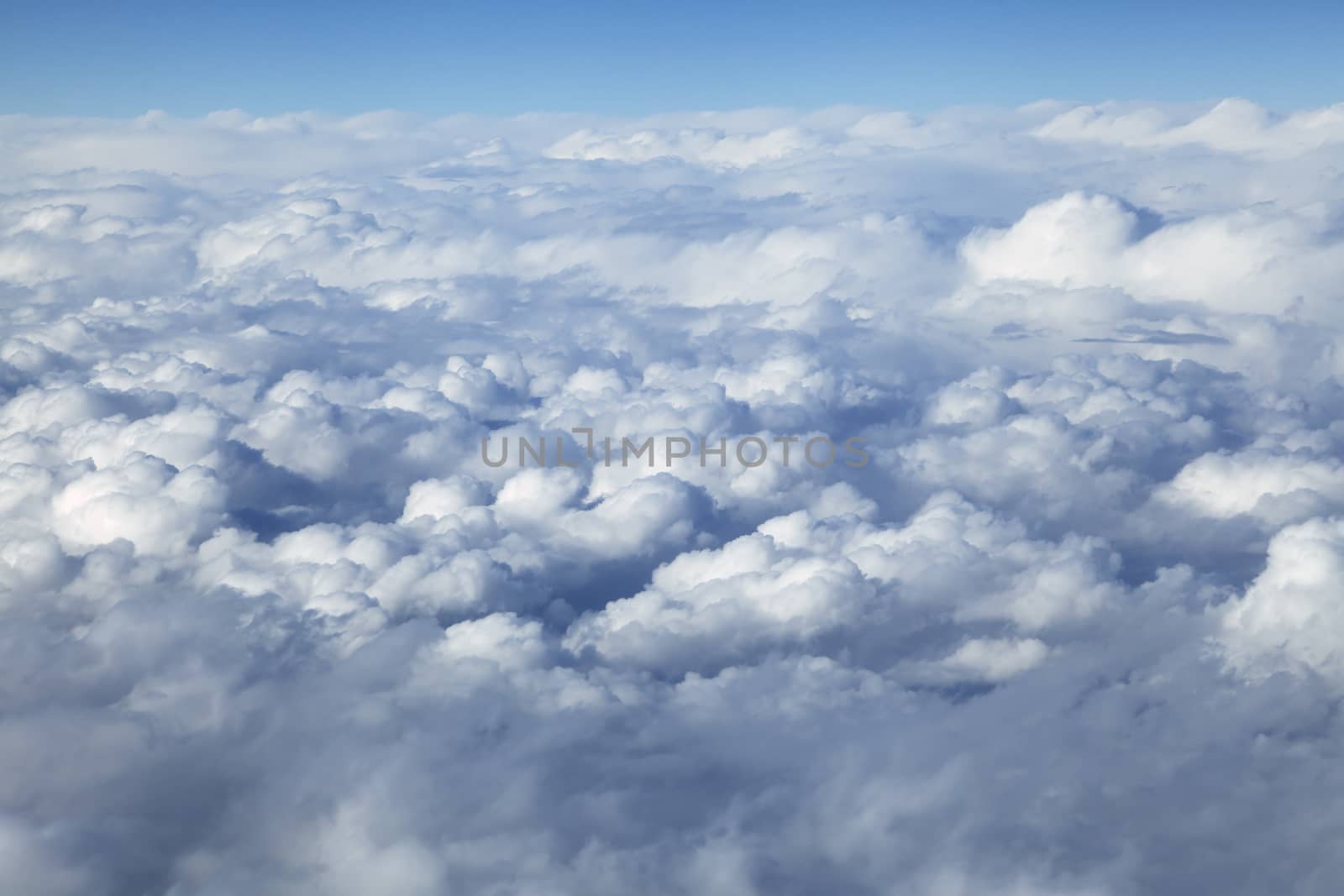 Wing of an airplane and the land below