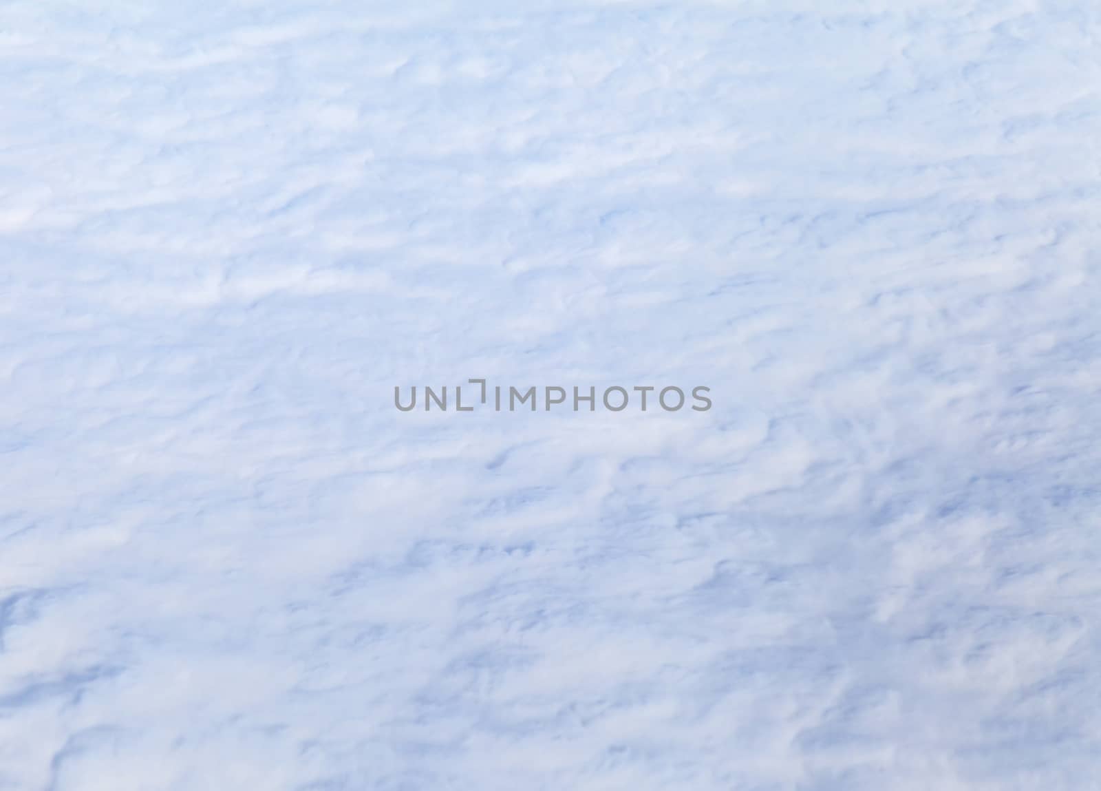 Wing of an airplane and the land below