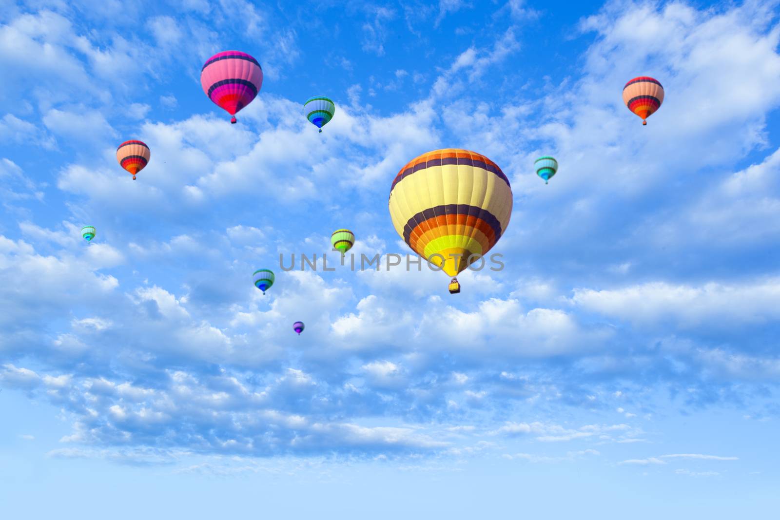 Hot air balloon flying in a blue sky